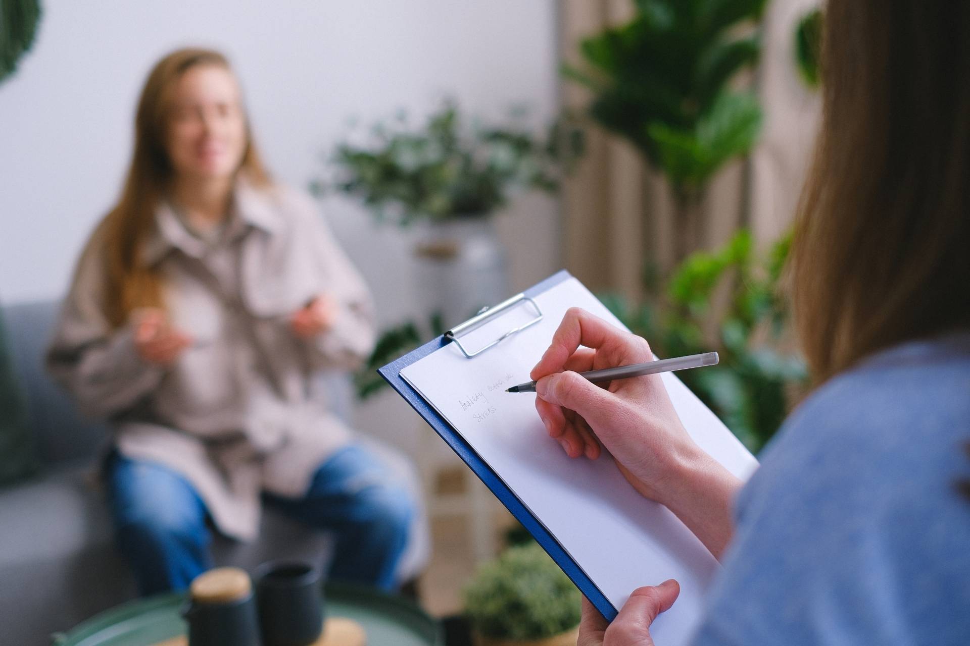 Licensed clinician providing one-on-one counseling at a wellness treatment center.